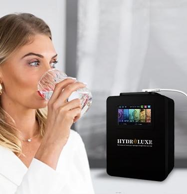 a woman drinking of molecular hydrogen water and hydroluxe ionizer filter